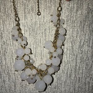 White gem necklace with gold chain